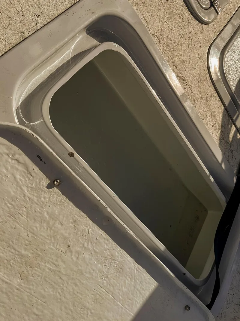Slide: The Image of Open storage compartment on a 2022 Bossman 17 Flats Boat. - 6