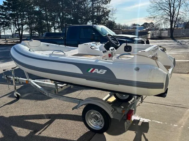 Slide: The Image of 2024 AB Inflatables ABJET 290 on trailer, parked outdoors in sunlight. - 4