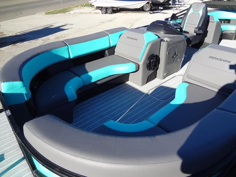 Slide: The Image of 2023 Berkshire 25RFX STS 3.0+ pontoon boat with teal and gray seating. - 12