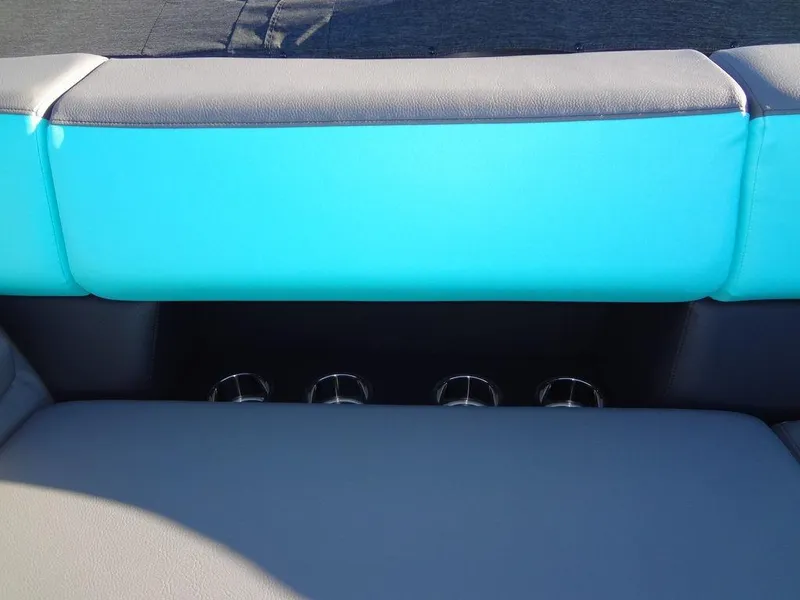 Slide: The Image of 2023 Berkshire 25RFX STS 3.0+ boat seating with turquoise and gray upholstery. - 15