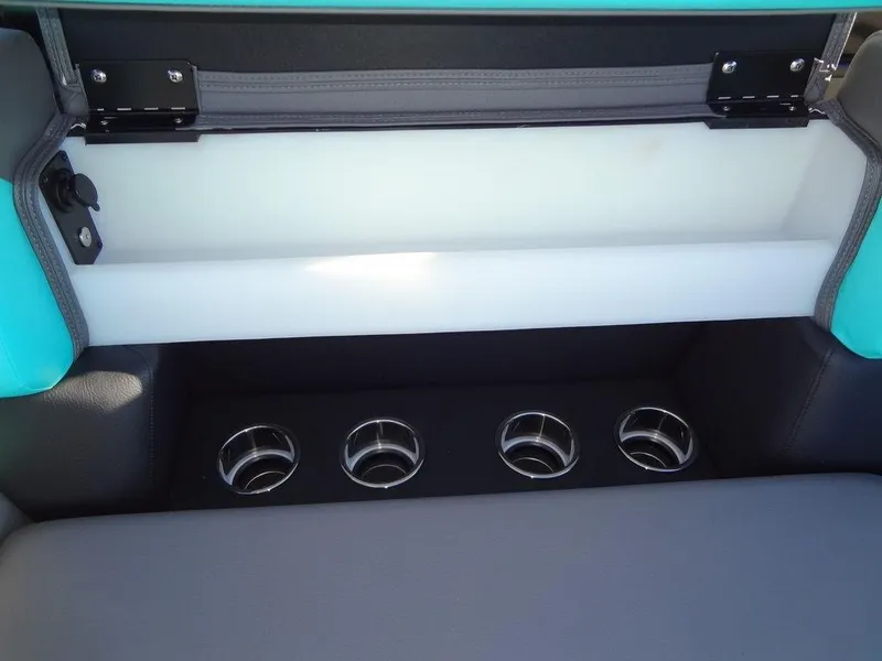 Slide: The Image of 2023 Berkshire 25RFX STS 3.0+ boat interior with cup holders and storage compartment. - 17