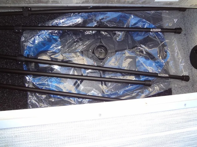 Slide: The Image of 2023 Berkshire 25RFX STS 3.0+ boat storage compartment with accessories. - 21