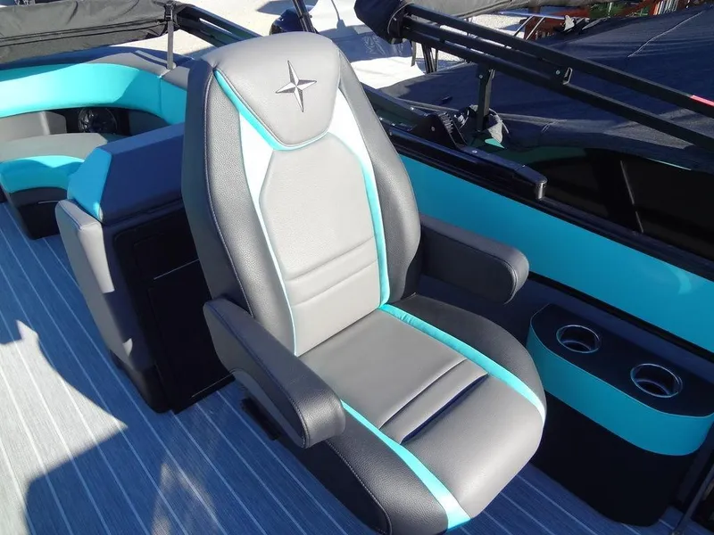 Slide: The Image of Captain's chair on 2023 Berkshire 25RFX STS 3.0+ pontoon boat, featuring sleek design and cup holders. - 24