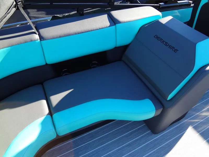 Slide: The Image of 2023 Berkshire 25RFX STS 3.0+ boat seating, turquoise and gray upholstery. - 25