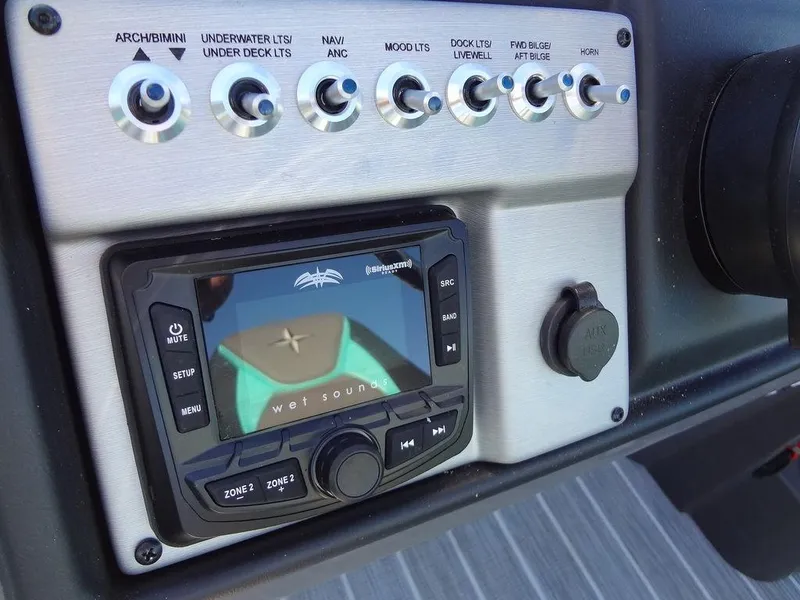 Slide: The Image of Control panel of 2023 Berkshire 25RFX STS 3.0+ with audio system and switches. - 28