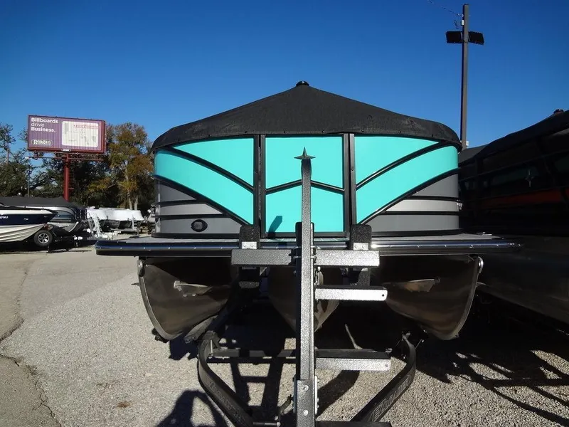 Slide: The Image of 2023 Berkshire 25RFX STS 3.0+ pontoon boat on trailer, vibrant teal and black design. - 3