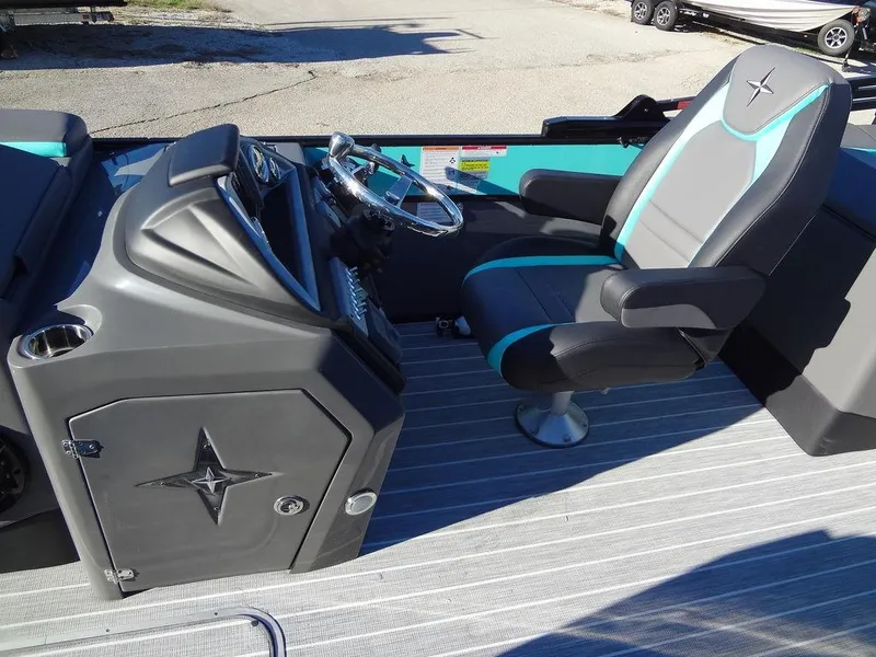 Slide: The Image of 2023 Berkshire 25RFX STS 3.0+ boat interior with sleek captain's chair and modern dashboard. - 30