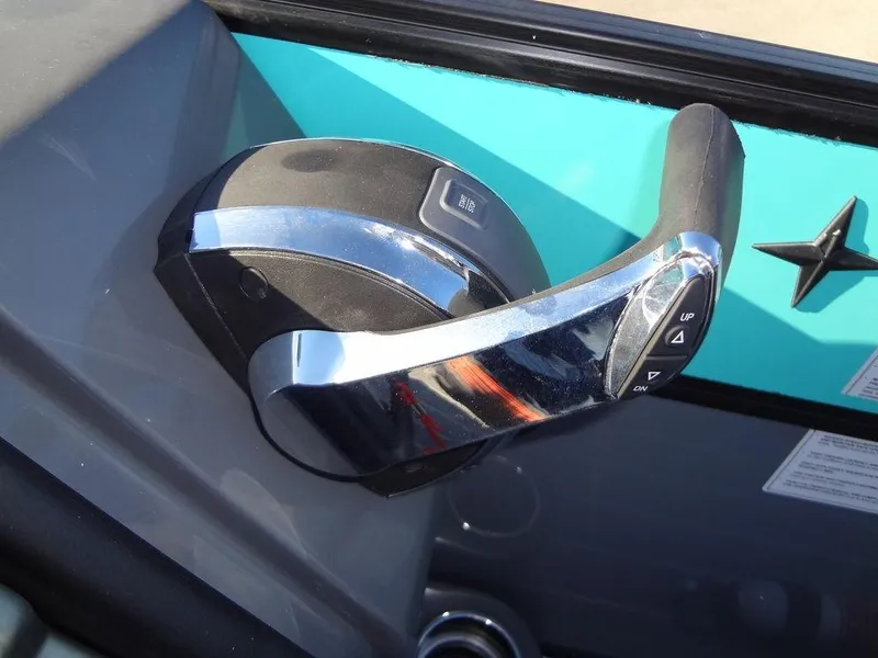Slide: The Image of Throttle control of 2023 Berkshire 25RFX STS 3.0+ boat, featuring sleek chrome finish. - 33