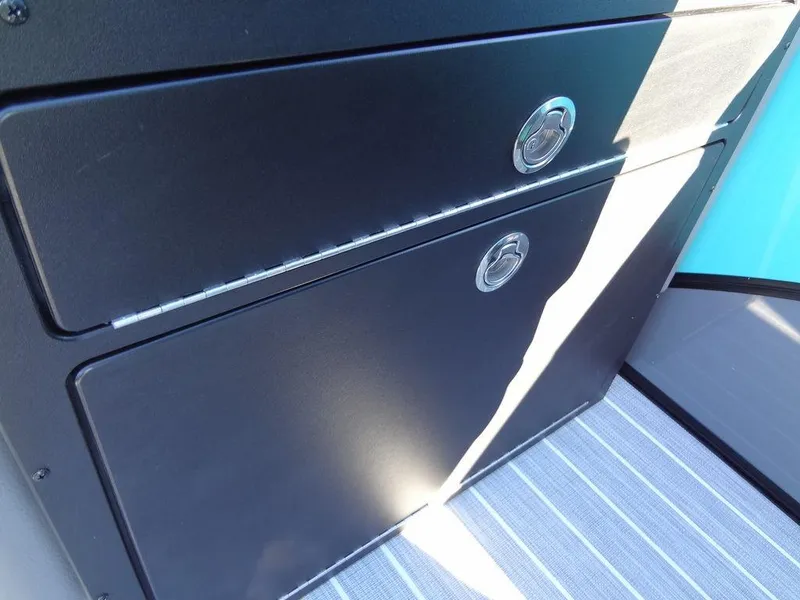 Slide: The Image of 2023 Berkshire 25RFX STS 3.0+ interior storage compartments with sleek black finish. - 37