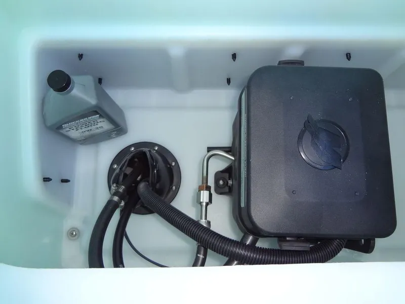 Slide: The Image of 2023 Berkshire 25RFX STS 3.0+ engine compartment with fluid container and wiring. - 46