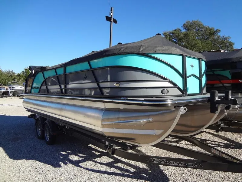 Slide: The Image of 2023 Berkshire 25RFX STS 3.0+ pontoon boat on trailer, teal and black design. - 5