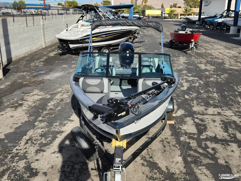 Slide: The Image of 2023 Lund 1775 Crossover XS boat on trailer in outdoor showroom. - 1