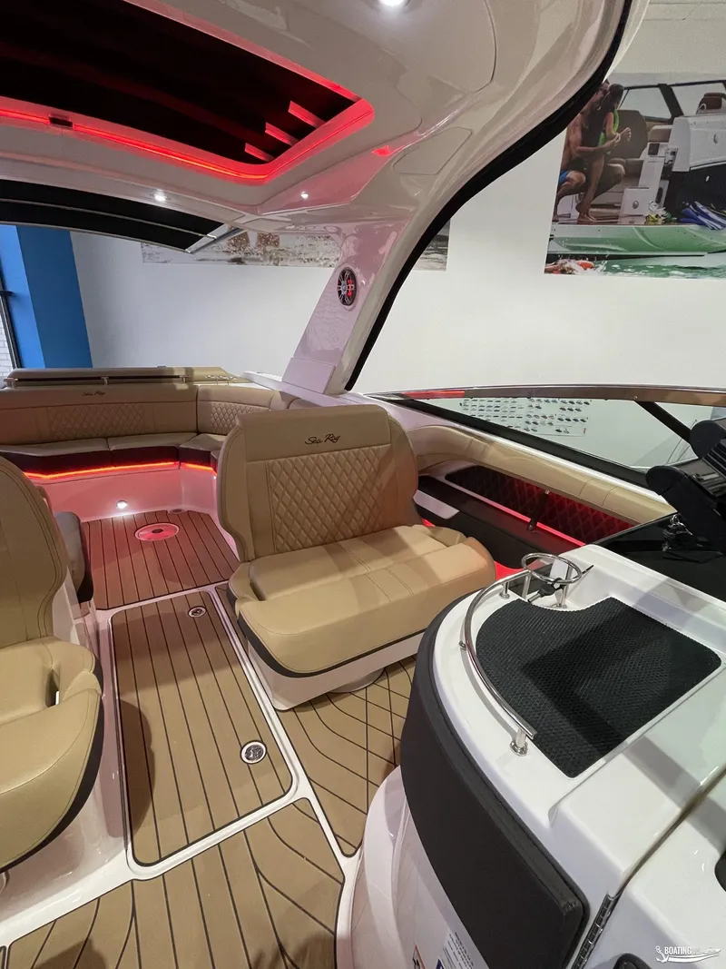 Slide: The Image of Luxurious interior of 2023 Sea Ray 310 SLX boat with elegant seating and ambient lighting. - 10