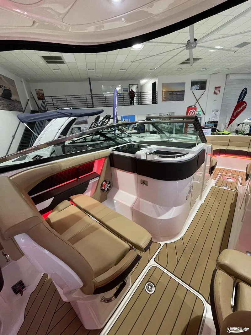 Slide: The Image of 2023 Sea Ray 310 SLX boat interior with luxurious seating and modern design. - 16