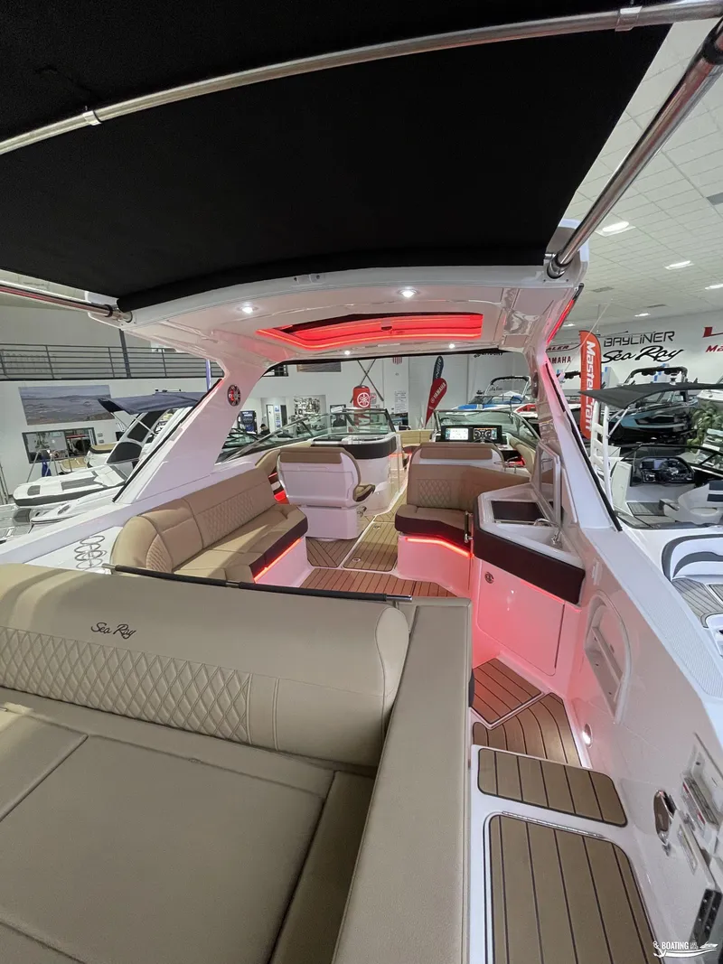 Slide: The Image of Luxurious interior of 2023 Sea Ray 310 SLX boat with ambient lighting. - 5