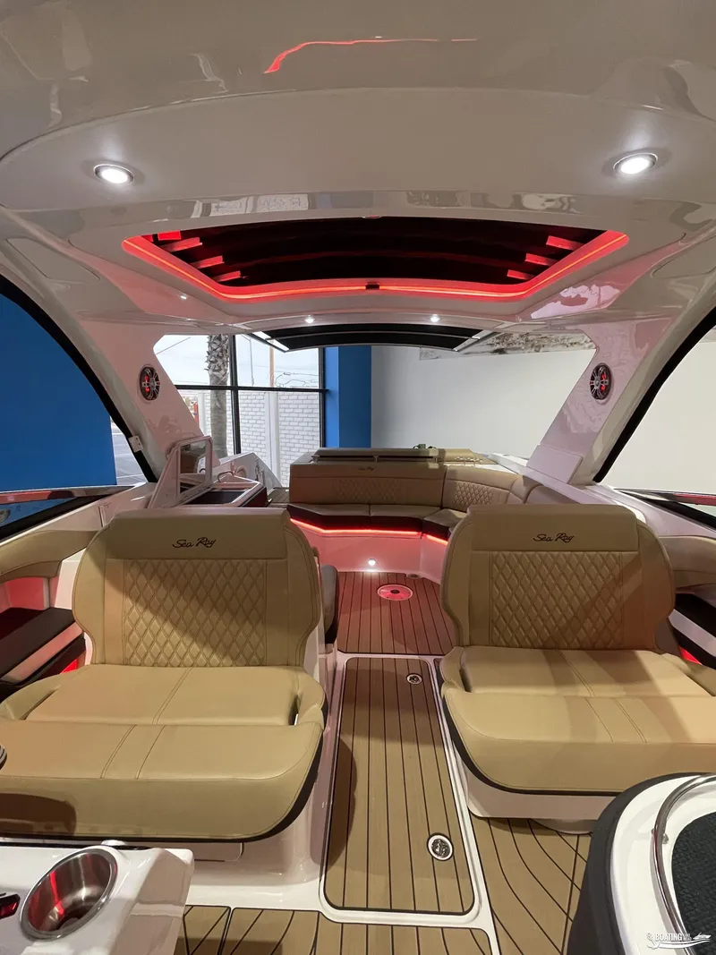Slide: The Image of Luxurious interior of 2023 Sea Ray 310 SLX boat with elegant seating and ambient lighting. - 8
