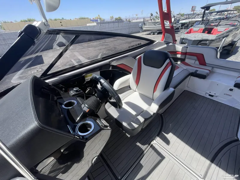 Slide: The Image of 2018 Yamaha Boats 242 X E Series cockpit with steering wheel and seating. - 8