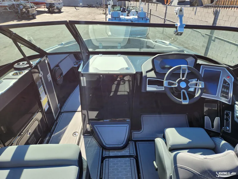 Slide: The Image of 2023 MasterCraft X26 boat interior with modern dashboard and steering wheel. - 10