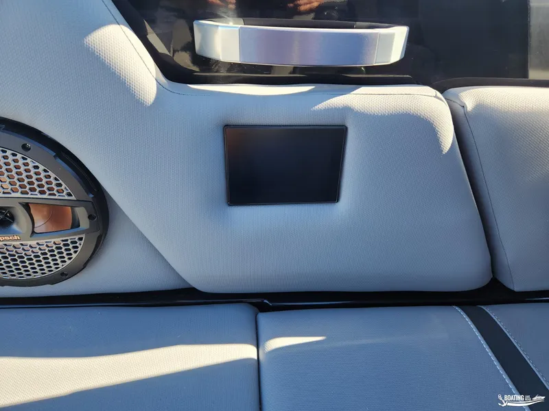 Slide: The Image of 2023 MasterCraft X26 interior with speaker and sleek upholstery design. - 18