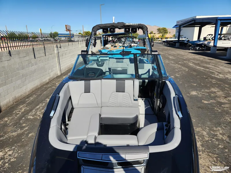 Slide: The Image of 2023 MasterCraft X26 boat with sleek design and spacious seating. - 4