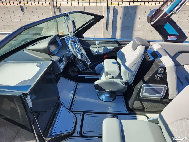 Slide: The Image of 2023 MasterCraft X26 boat interior with modern dashboard and seating. - 5