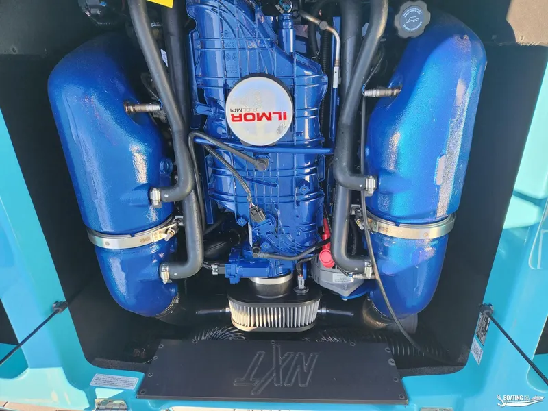 Slide: The Image of 2023 MasterCraft NXT20 engine with Ilmor branding, showcasing blue components. - 25