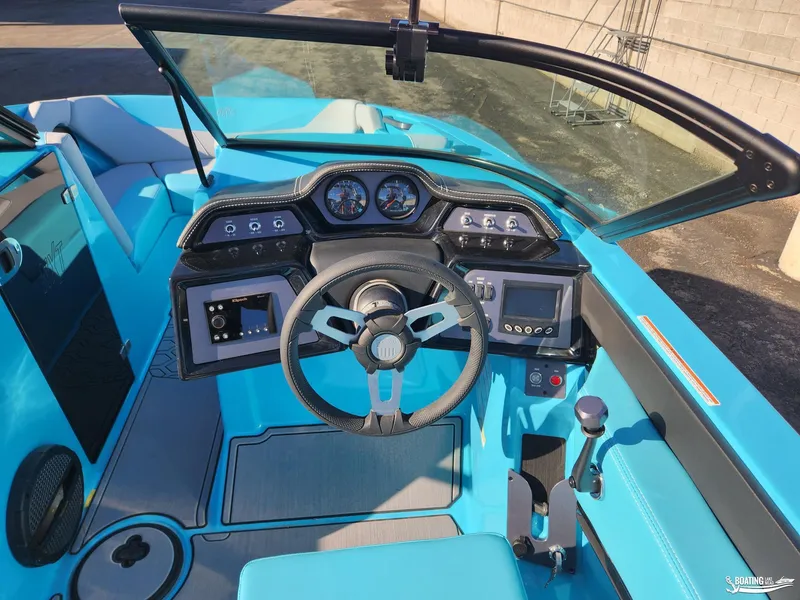 Slide: The Image of 2023 MasterCraft NXT20 boat interior with modern dashboard and steering wheel. - 7
