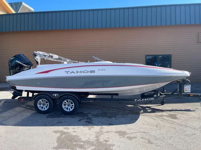 Slide: The Image of 2023 Tahoe 2150 boat on a trailer, side view. - 2
