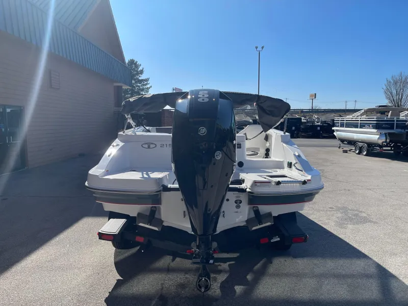 Slide: The Image of 2023 Tahoe 2150 boat with outboard motor, rear view in a parking lot. - 3