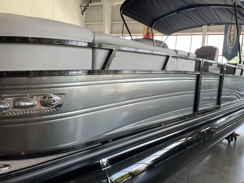 Slide: The Image of 2023 Regency 230 LE3 pontoon boat in showroom. - 0