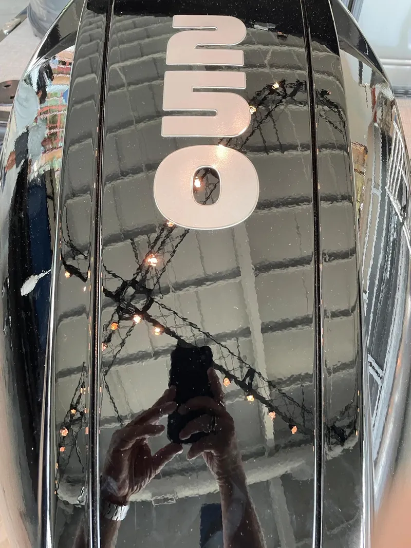 Slide: The Image of Close-up of a 2023 Regency 230 LE3 boat engine with 250 label. - 1