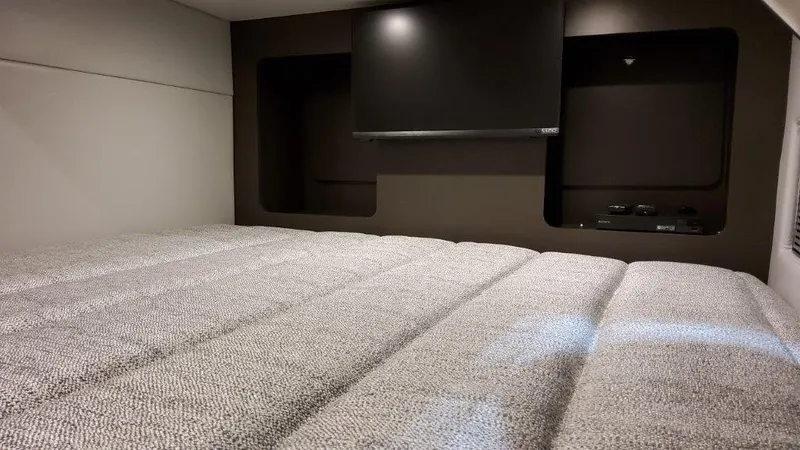 Slide: The Image of 2022 Formula 350 Crossover Bowrider cabin with bed and TV. - 12