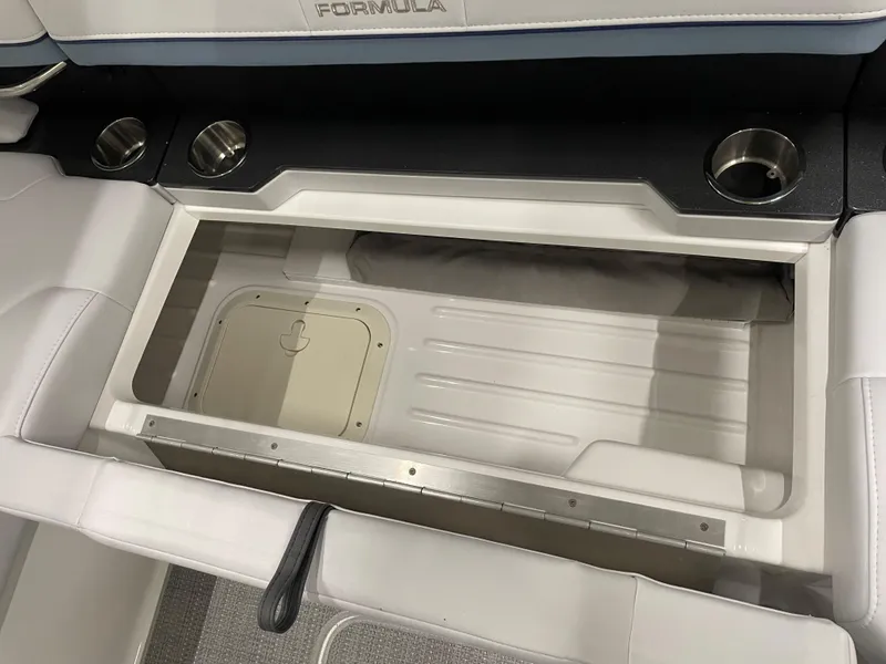 Slide: The Image of 2022 Formula 350 Crossover Bowrider storage compartment with cup holders. - 23