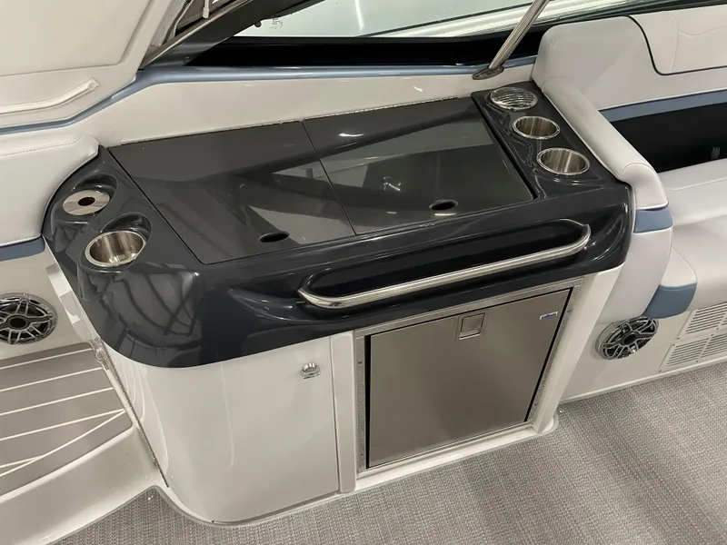 Slide: The Image of 2022 Formula 350 Crossover Bowrider interior with sleek kitchenette and stainless steel fixtures. - 25