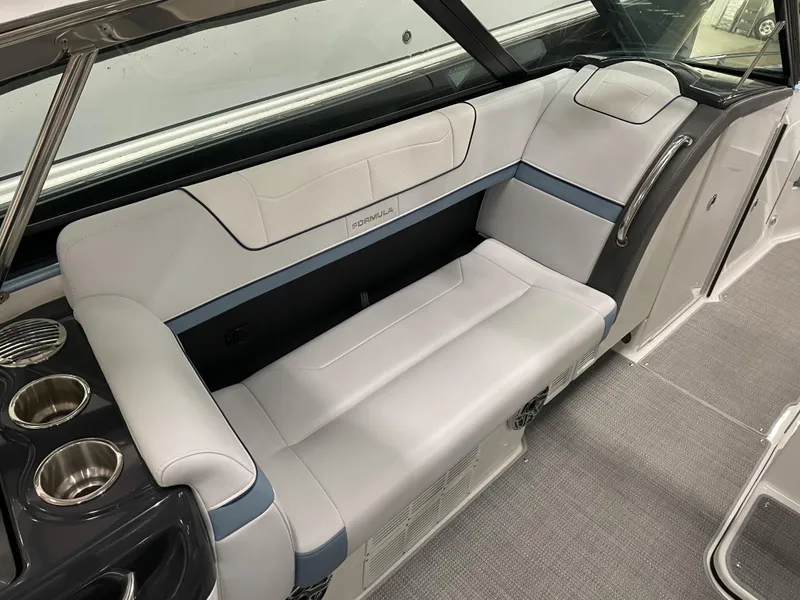 Slide: The Image of 2022 Formula 350 Crossover Bowrider interior seating with cup holders and modern design. - 27
