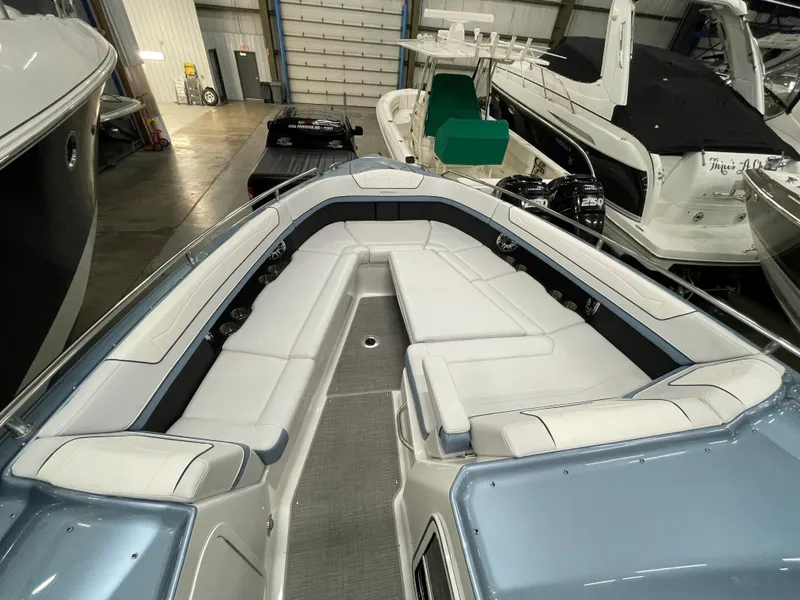 Slide: The Image of 2022 Formula 350 Crossover Bowrider interior with spacious seating in a showroom. - 38