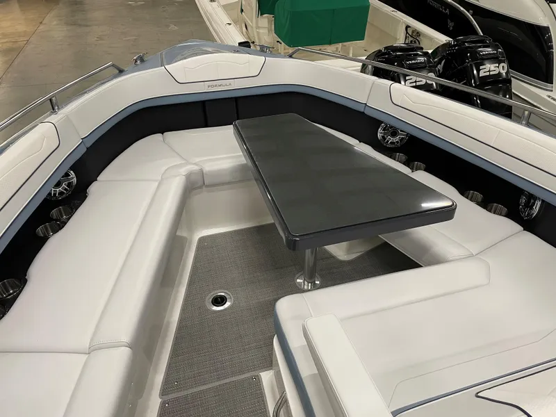 Slide: The Image of 2022 Formula 350 Crossover Bowrider interior with seating and table. - 40
