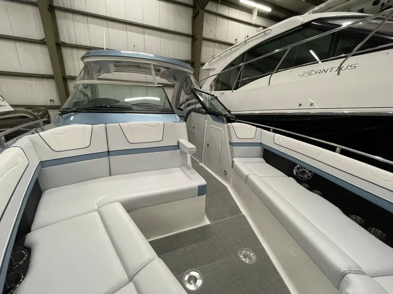 Slide: The Image of 2022 Formula 350 Crossover Bowrider interior, spacious seating, luxury boat in showroom. - 47
