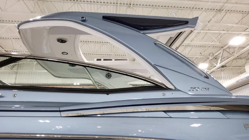 Slide: The Image of 2022 Formula 350 Crossover Bowrider, sleek design, side view in showroom. - 5