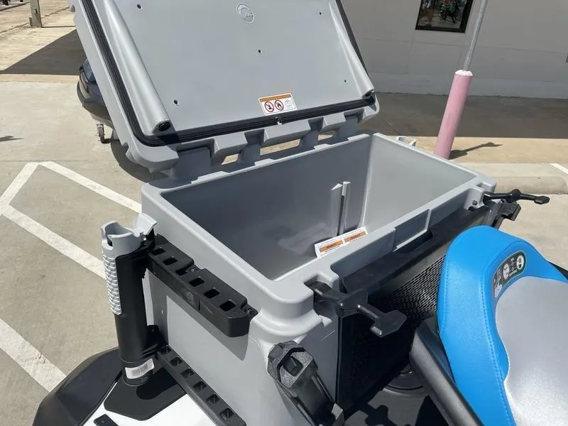 Slide: The Image of 2022 Sea-Doo FISH PRO storage compartment open, showcasing spacious interior and fishing rod holders. - 2