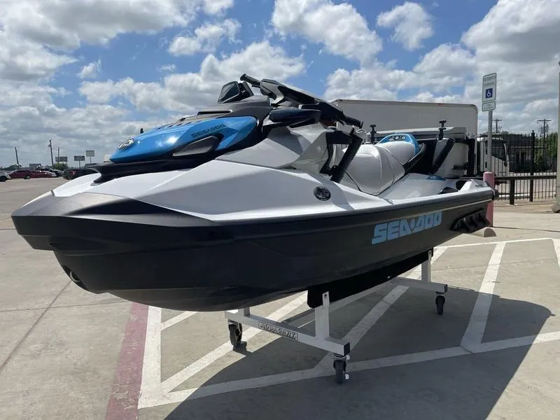 Slide: The Image of 2022 Sea-Doo FISH PRO jet ski displayed outdoors on a sunny day. - 6