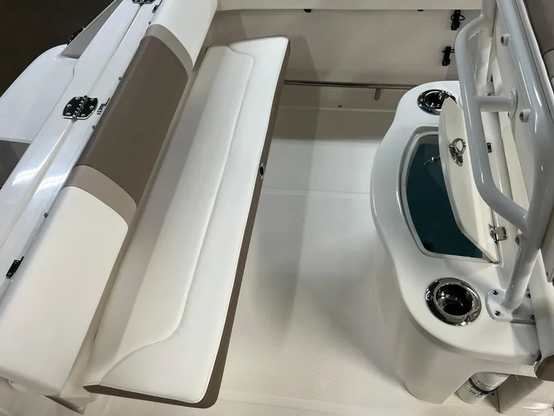 Slide: The Image of 2023 Robalo R222 Center Console boat interior with seating and storage. - 13