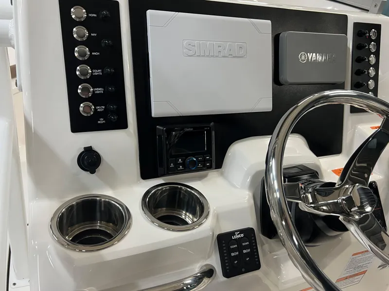 Slide: The Image of 2023 Robalo R222 Center Console dashboard with Simrad and Yamaha controls. - 17