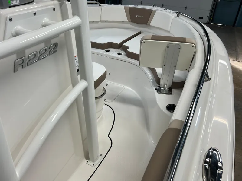 Slide: The Image of 2023 Robalo R222 Center Console boat interior with seating and storage. - 18