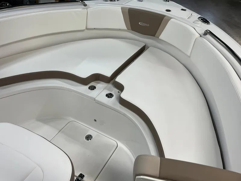 Slide: The Image of 2023 Robalo R222 Center Console boat interior with cushioned seating. - 19