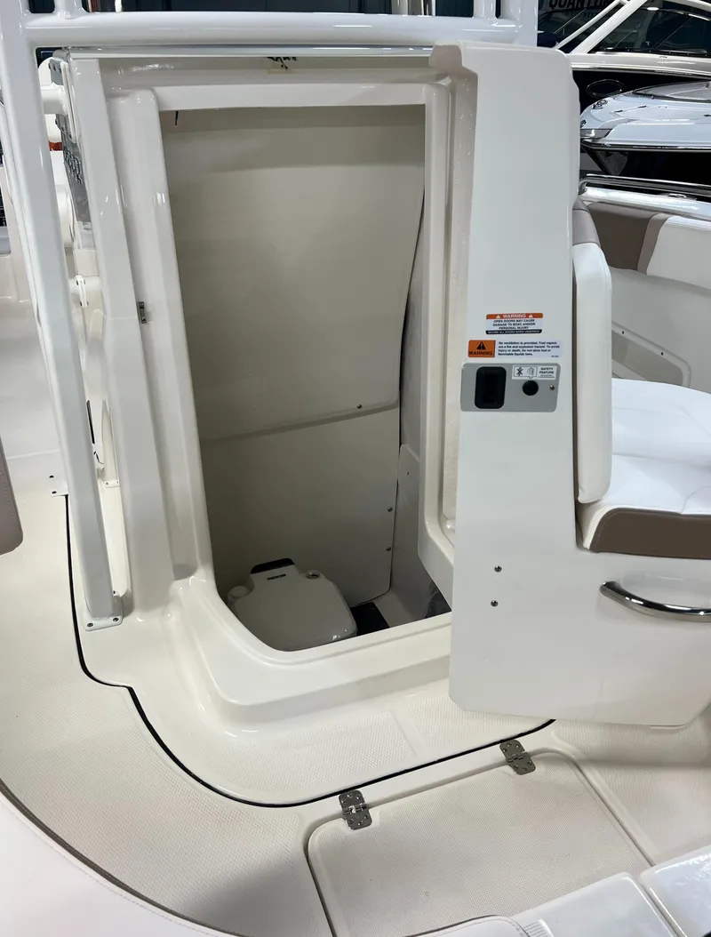 Slide: The Image of 2023 Robalo R222 Center Console boat interior with open storage compartment. - 21