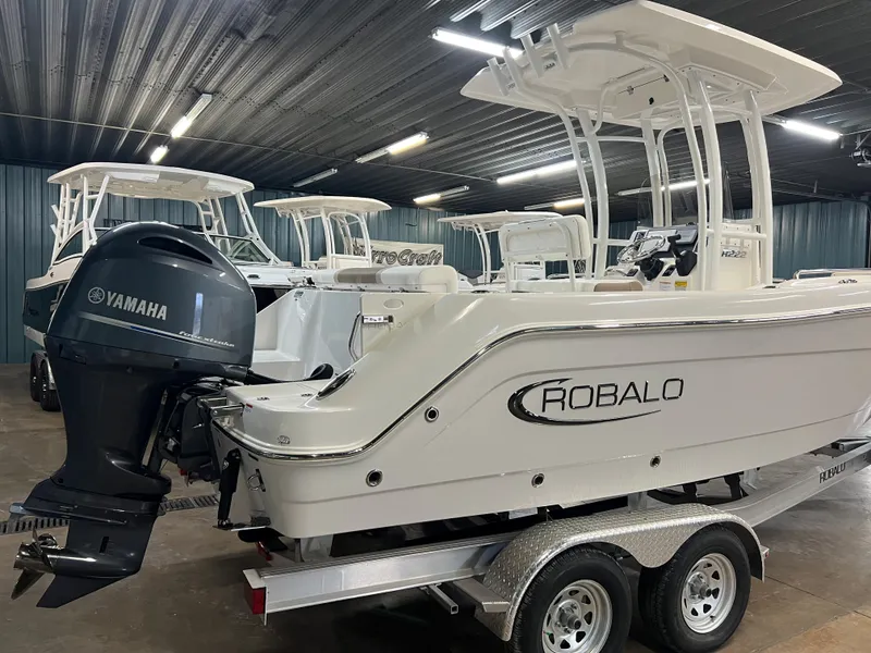 Slide: The Image of 2023 Robalo R222 Center Console boat with Yamaha engine in showroom. - 7