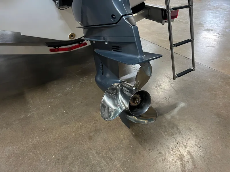Slide: The Image of 2023 Robalo R222 Center Console boat propeller and ladder on display. - 8