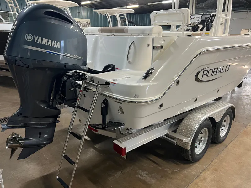 Slide: The Image of 2023 Robalo R222 Center Console boat with Yamaha outboard motor on trailer. - 9