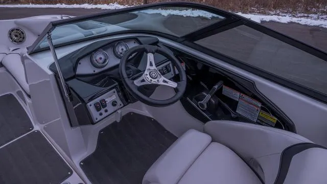 Slide: The Image of The image shows the cockpit of a 2014 Yamaha SX192 boat with a modern helm. - 6
